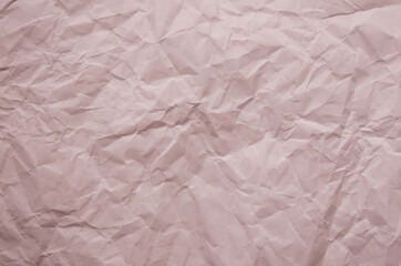 Texture of crumpled imitation craft paper. Recycle old purple pink paper background