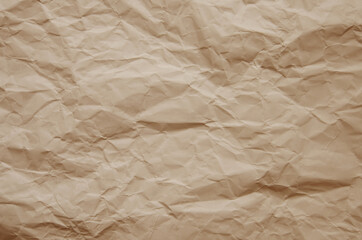Texture of crumpled imitation craft paper. Recycle old brown paper background