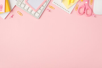 Top view photo of pink and yellow stationery reminders pens clips pins scissors stickers id keyboard and mouse on isolated pastel pink background with copyspace