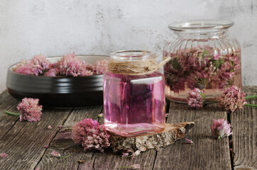 Glass jar with vinegar based on onion inflorescences.