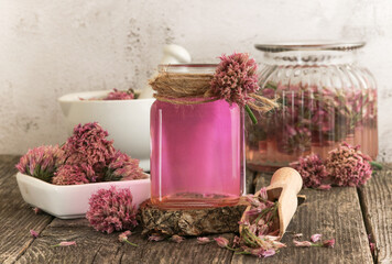 Glass jar with vinegar based on onion inflorescences.