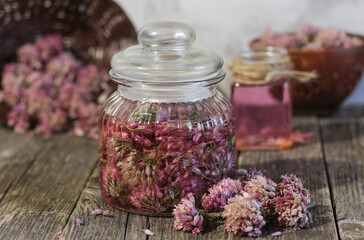 Glass jar with vinegar based on onion inflorescences.