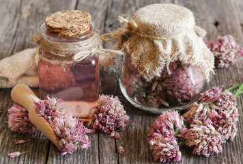 Glass jar with vinegar based on onion inflorescences.