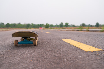 Close up skateboard on the road.Extreme sport equipment tool.