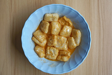 Cowhide crackers with curry sauce. Typical padang food.