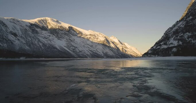 Tranquil Scenery Of Snow Covered Mountain And Frozen River In Eresfjord, Norway - static shot