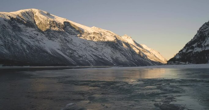 Scenic View Of Snow Mountain And Frozen Stream In Eresfjord, Norway - static shot
