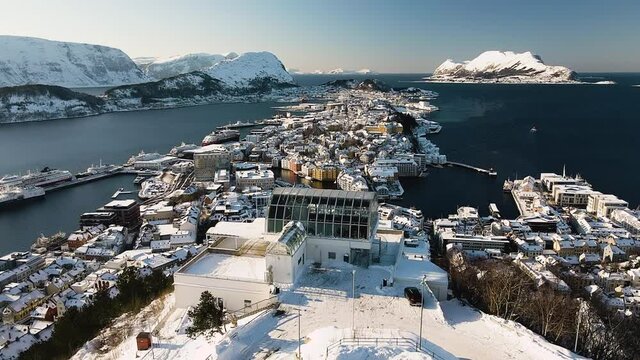 Fjellstua Restaurant And Viewpoint In Mount Aksla Overlooking Island Of Aspoya In Alesund, Norway. aerial pullback