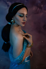 Beautiful princess closeup on the night sky background. Art photo.Jasmine princess cosplay.
