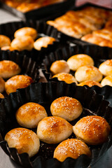 Fresh homemade bread taken from the wood oven. Close up of rustic whole meal bread rolls