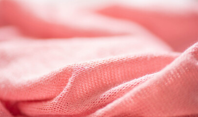 Pink knitted background fabric texture. 