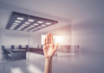 Choosing gesture of person in elegant modern interior in sunshine light