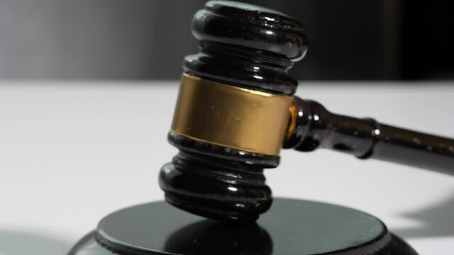  Equipment lawyer gavel being struck to decide an auction or guilty verdict in court