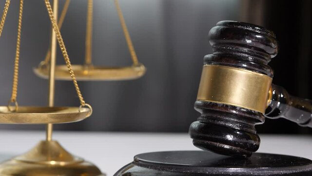  Equipment lawyer gavel being struck to decide an auction or guilty verdict in court