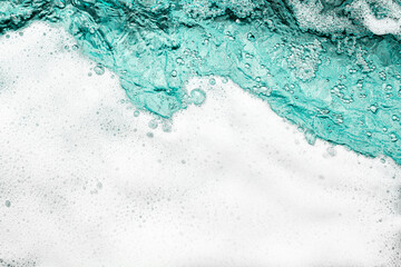 Fototapeta na wymiar Blue sea water white foam texture background closeup, foamy ocean wave pattern, aqua bubbles surface, swimming pool backdrop, abstract summer sunny beach wallpaper, decorative frame border, copy space