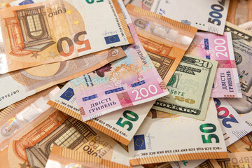 Money from different countries hryvnia, dollars and euros