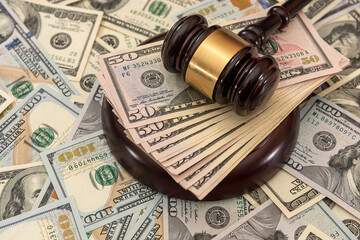 financial judges gavel with dollars