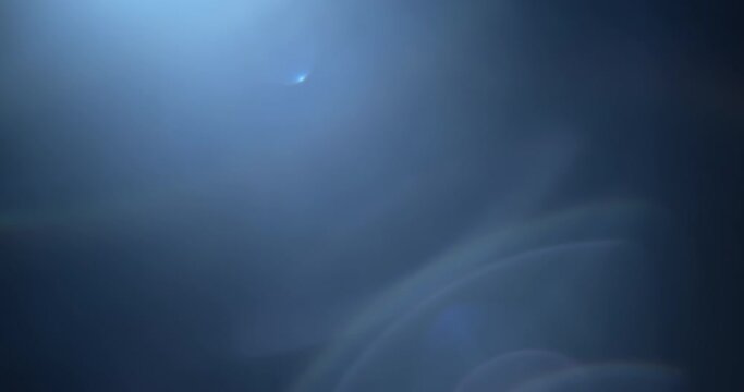 A pack of four blue lens flares and light leaks overlays in slow motion. 