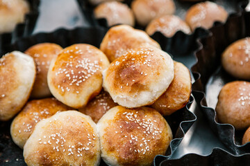 Fresh homemade bread taken from the wood oven. Close up of rustic whole meal bread rolls