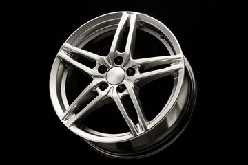 alloy wheel, sporty alloy, in the shape of a star on a dark background