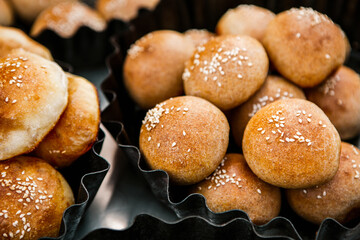 Fresh homemade bread taken from the wood oven. Close up of rustic whole meal bread rolls