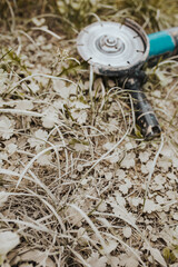 Concrete dust on grass after cutting bricks and tiles - dirty work at a construction site