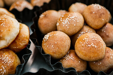 Fresh homemade bread taken from the wood oven. Close up of rustic whole meal bread rolls