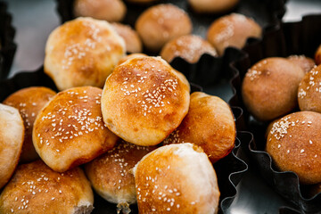 Fresh homemade bread taken from the wood oven. Close up of rustic whole meal bread rolls