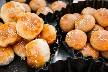 Fresh homemade bread taken from the wood oven. Close up of rustic whole meal bread rolls