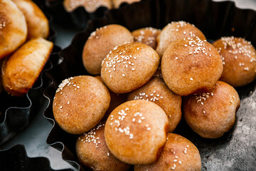 Fresh homemade bread taken from the wood oven. Close up of rustic whole meal bread rolls