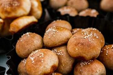 Fresh homemade bread taken from the wood oven. Close up of rustic whole meal bread rolls