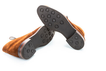 Pair of Male Brown Suede Chukka Boots Placed One on One Together On White Background.