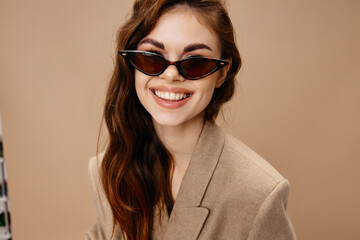 attractive woman in beige coat beautiful smile glasses hairstyle model