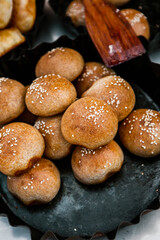 Fresh homemade bread taken from the wood oven. Close up of rustic whole meal bread rolls