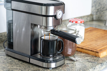 Making coffee at home with an espresso machine