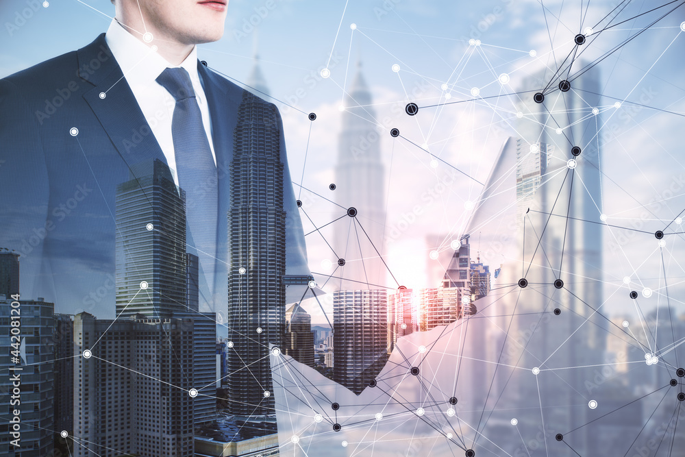 Poster businessman using laptop on abstract city background with digital mesh. communication and technology