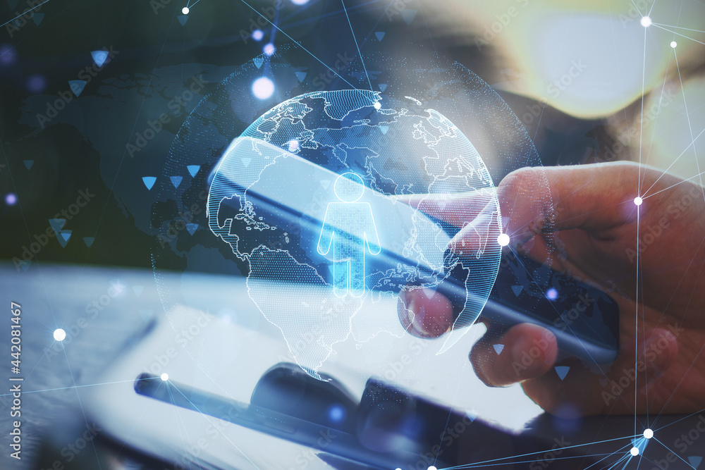 Poster Close up of hand using smartphone with globe and person icon hologram on blurry desktop background. Online recruiting and hiring concept. Double exposure.