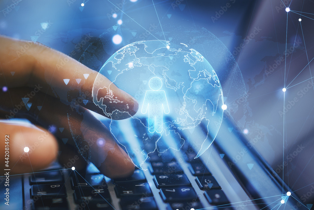 Aufkleber close up of hand using laptop with globe and person icon hologram on blurry desktop background. onli