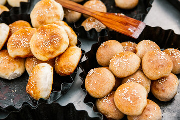 Fresh homemade bread taken from the wood oven. Close up of rustic whole meal bread rolls