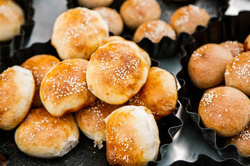 Fresh homemade bread taken from the wood oven. Close up of rustic whole meal bread rolls