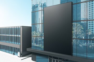 Clean black billboard on shiny glass building exterior with reflections and daylight. Mock up, 3D Rendering.