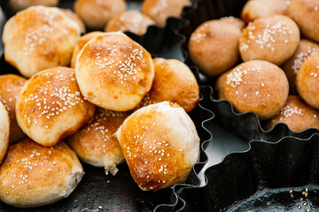 Fresh homemade bread taken from the wood oven. Close up of rustic whole meal bread rolls