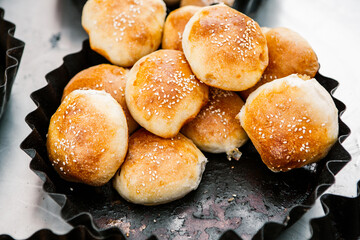 Fresh homemade bread taken from the wood oven. Close up of rustic whole meal bread rolls