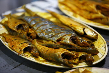 Hot spicy tasty fresh caught sea fish with masala spice marinated ready for deep fry cooking