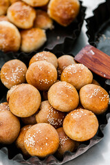 Fresh homemade bread taken from the wood oven. Close up of rustic whole meal bread rolls