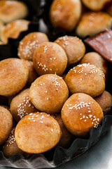 Fresh homemade bread taken from the wood oven. Close up of rustic whole meal bread rolls
