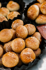 Fresh homemade bread taken from the wood oven. Close up of rustic whole meal bread rolls