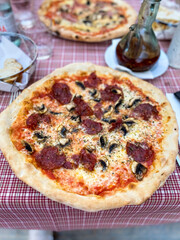 Spicy pizza with salami and mushrooms, Puerto Andratx, Mallorca, Spain