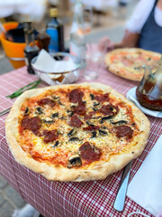 Spicy pizza with salami and mushrooms, Puerto Andratx, Mallorca, Spain