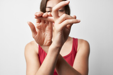 woman with joint pain in fingers arthritis treatment close-up